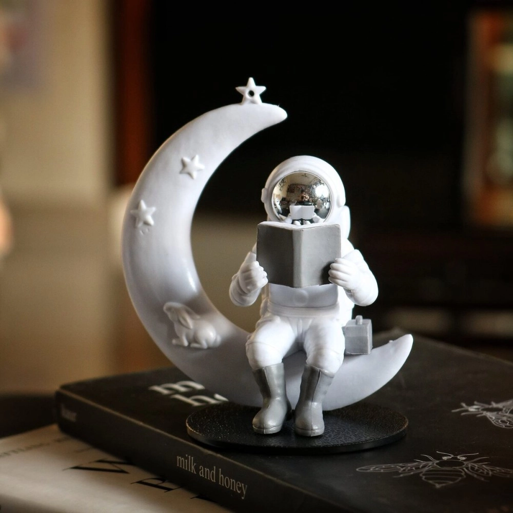 Street27 Astronaut Figurine Showpiece for Home Dcor Idols for Office Desk Table Astronaut Toy for Car Dashboard, Statue for Gift Gifting Items Birthday Decoration (Reading on Moon - Silver)