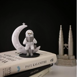 Street27 Astronaut Figurine Showpiece for Home Dcor Idols for Office Desk Table Astronaut Toy for Car Dashboard, Statue for Gift Gifting Items Birthday Decoration (Reading on Moon - Silver)